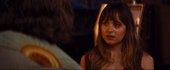 Movie still from “Bad Times at the El Royale” (2018), directed by Drew Goddard – A person sitting in front of a window; Close Up shot, Over the shoulder angle