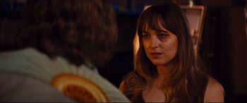 Movie still from “Bad Times at the El Royale” (2018), directed by Drew Goddard – A person looking at another person; Close Up shot, Over the shoulder angle