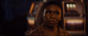 Movie still from “Bad Times at the El Royale” (2018), directed by Drew Goddard – A person looking at the camera; Close Up shot, Over the shoulder angle