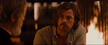 Movie still from “Bad Times at the El Royale” (2018), directed by Drew Goddard – A person with long hair; Close Up shot, Over the shoulder angle