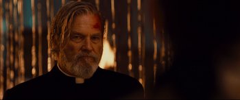 Movie still from “Bad Times at the El Royale” (2018), directed by Drew Goddard – A man with a beard and a cross on his forehead; Close Up shot, Low angle