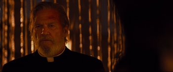 Movie still from “Bad Times at the El Royale” (2018), directed by Drew Goddard – An older man wearing a clergyman's outfit; Close Up shot, Low angle