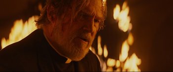 Movie still from “Bad Times at the El Royale” (2018), directed by Drew Goddard – An old man with a beard and a white beard; Close Up shot, Over the shoulder angle