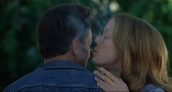 Movie still from “Badlands” (1973), directed by Terrence Malick – A man and a woman are smoking a cigarette together; Close Up shot, Over the shoulder angle