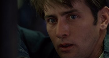 Movie still from “Badlands” (1973), directed by Terrence Malick – A man's eyes and face; Close Up shot, Low angle