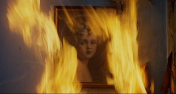 Movie still from “Badlands” (1973), directed by Terrence Malick – A picture of an angel in front of a fire; Extreme Close Up shot, Low angle