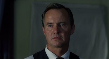 Movie still from “Badlands” (1973), directed by Terrence Malick – A person wearing a suit and tie; Close Up shot, Low angle