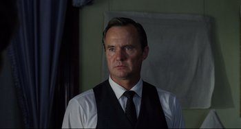 Movie still from “Badlands” (1973), directed by Terrence Malick – A man wearing a vest and a tie; Close Up shot, Low angle