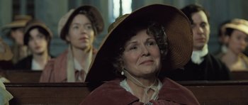 Movie still from “Becoming Jane” (2007), directed by Julian Jarrold – An older woman wearing a large hat and a young man wearing a hat; Close Up shot, Low angle
