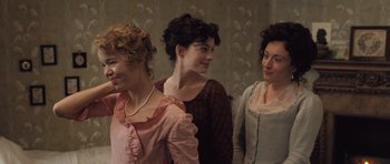Movie still from “Becoming Jane” (2007), directed by Julian Jarrold – A group of women standing next to each other; Medium shot, Over the shoulder angle