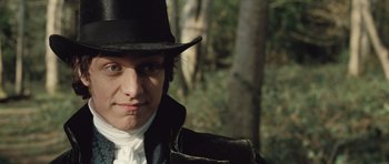 Movie still from “Becoming Jane” (2007), directed by Julian Jarrold – A young man wearing a black hat and a black jacket; Close Up shot, Over the shoulder angle