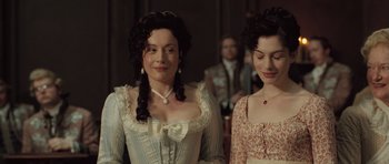 Movie still from “Becoming Jane” (2007), directed by Julian Jarrold – Two women dressed in period clothing standing next to each other; Close Up shot, Over the shoulder angle