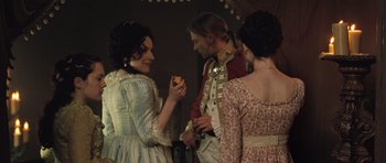 Movie still from “Becoming Jane” (2007), directed by Julian Jarrold – A group of people standing next to each other; Medium shot, Over the shoulder angle