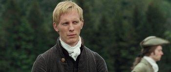 Movie still from “Becoming Jane” (2007), directed by Julian Jarrold – A man with blonde hair wearing a black jacket; Close Up shot, High angle