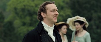 Movie still from “Becoming Jane” (2007), directed by Julian Jarrold – A man in a black jacket and a white shirt; Close Up shot, Low angle