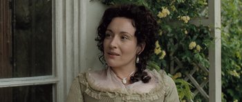 Movie still from “Becoming Jane” (2007), directed by Julian Jarrold – A person with curly hair wearing a dress; Close Up shot, Over the shoulder angle