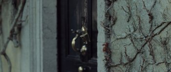 Movie still from “Becoming Jane” (2007), directed by Julian Jarrold – A door with a chain hanging from it; Extreme Close Up shot, High angle