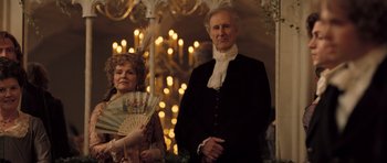 Movie still from “Becoming Jane” (2007), directed by Julian Jarrold – An older man and woman dressed in period clothing; Medium shot, Low angle