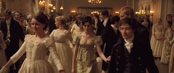 Movie still from “Becoming Jane” (2007), directed by Julian Jarrold – A group of people dressed in formal attire; Medium shot, High angle