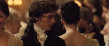 Movie still from “Becoming Jane” (2007), directed by Julian Jarrold – A man and a woman in formal wear looking at one another; Close Up shot, Over the shoulder angle