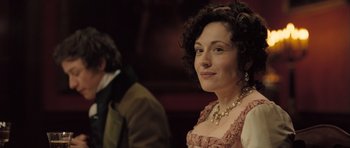 Movie still from “Becoming Jane” (2007), directed by Julian Jarrold – A woman in a pink dress and a man in a brown suit; Close Up shot, Over the shoulder angle