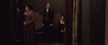 Movie still from “Becoming Jane” (2007), directed by Julian Jarrold – A man and a woman sitting on a bench; Wide shot, Over the shoulder angle