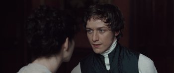 Movie still from “Becoming Jane” (2007), directed by Julian Jarrold – A young man in a black and white shirt looking at another young man in a black and white shirt; Close Up shot, Over the shoulder angle