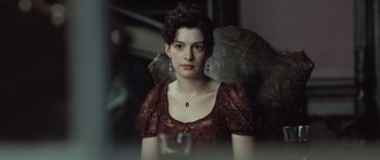 Movie still from “Becoming Jane” (2007), directed by Julian Jarrold – A woman in a red dress holding an umbrella; Close Up shot, Over the shoulder angle