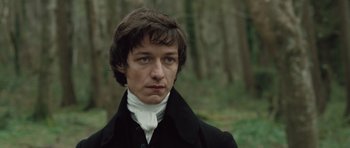 Movie still from “Becoming Jane” (2007), directed by Julian Jarrold – A man in a black coat and a white shirt; Close Up shot, Low angle