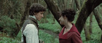 Movie still from “Becoming Jane” (2007), directed by Julian Jarrold – A man and a woman standing next to each other in the woods; Close Up shot, Over the shoulder angle