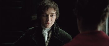 Movie still from “Becoming Jane” (2007), directed by Julian Jarrold – A young man in a green velvet jacket; Close Up shot, Over the shoulder angle