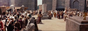 Movie still from “Ben-Hur” (1959), directed by William Wyler – A group of people gathered around a pillar; Extreme Wide shot, High angle