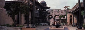 Movie still from “Ben-Hur” (1959), directed by William Wyler – People are walking in a courtyard of an old building; Extreme Wide shot, High angle