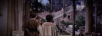 Movie still from “Ben-Hur” (1959), directed by William Wyler – A group of people standing on the side of a staircase; Extreme Wide shot, High angle
