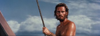 Movie still from “Ben-Hur” (1959), directed by William Wyler – A man holding a rope in his hands; Close Up shot, Low angle
