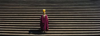 Movie still from “Ben-Hur” (1959), directed by William Wyler – A woman in a purple dress standing in front of some steps; Extreme Wide shot, Low angle