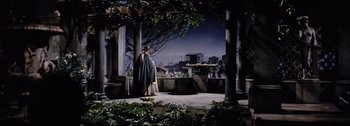 Movie still from “Ben-Hur” (1959), directed by William Wyler – A man standing in front of an outdoor setting; Extreme Wide shot, Over the shoulder angle