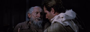 Movie still from “Ben-Hur” (1959), directed by William Wyler – A man with a beard is talking to another man; Close Up shot, Over the shoulder angle