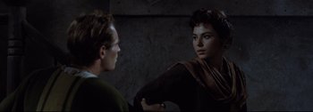 Movie still from “Ben-Hur” (1959), directed by William Wyler – A man and a woman are talking in a dark room; Close Up shot, Over the shoulder angle