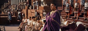 Movie still from “Ben-Hur” (1959), directed by William Wyler – A group of people dressed in ancient roman clothing; Medium shot, Over the shoulder angle