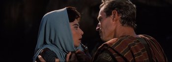 Movie still from “Ben-Hur” (1959), directed by William Wyler – A man and a woman face to face in a scene; Close Up shot, Over the shoulder angle