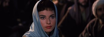 Movie still from “Ben-Hur” (1959), directed by William Wyler – A person wearing a scarf; Close Up shot, Over the shoulder angle