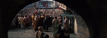 Movie still from “Ben-Hur” (1959), directed by William Wyler – A group of people standing in front of a building; Extreme Wide shot, High angle