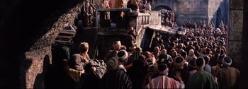 Movie still from “Ben-Hur” (1959), directed by William Wyler – A group of people standing around a building; Extreme Wide shot, High angle