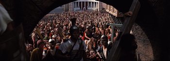 Movie still from “Ben-Hur” (1959), directed by William Wyler – A large crowd of people wearing roman helmets; Extreme Wide shot, High angle