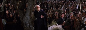 Movie still from “Ben-Hur” (1959), directed by William Wyler – An old man standing in front of a group of people; Wide shot, High angle
