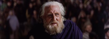 Movie still from “Ben-Hur” (1959), directed by William Wyler – An old man with white hair and a white beard; Close Up shot, Low angle
