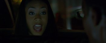 Movie still from “Collateral” (2004), directed by Michael Mann – A person in a car at night; Close Up shot, Over the shoulder angle