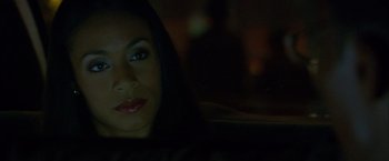 Movie still from “Collateral” (2004), directed by Michael Mann – A person sitting in a car at night; Close Up shot, Over the shoulder angle