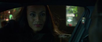Movie still from “Collateral” (2004), directed by Michael Mann – A beautiful woman sitting in the back seat of a car; Close Up shot, Over the shoulder angle